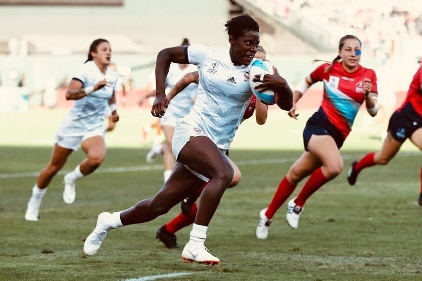 Naya running with the ball at a rugby game