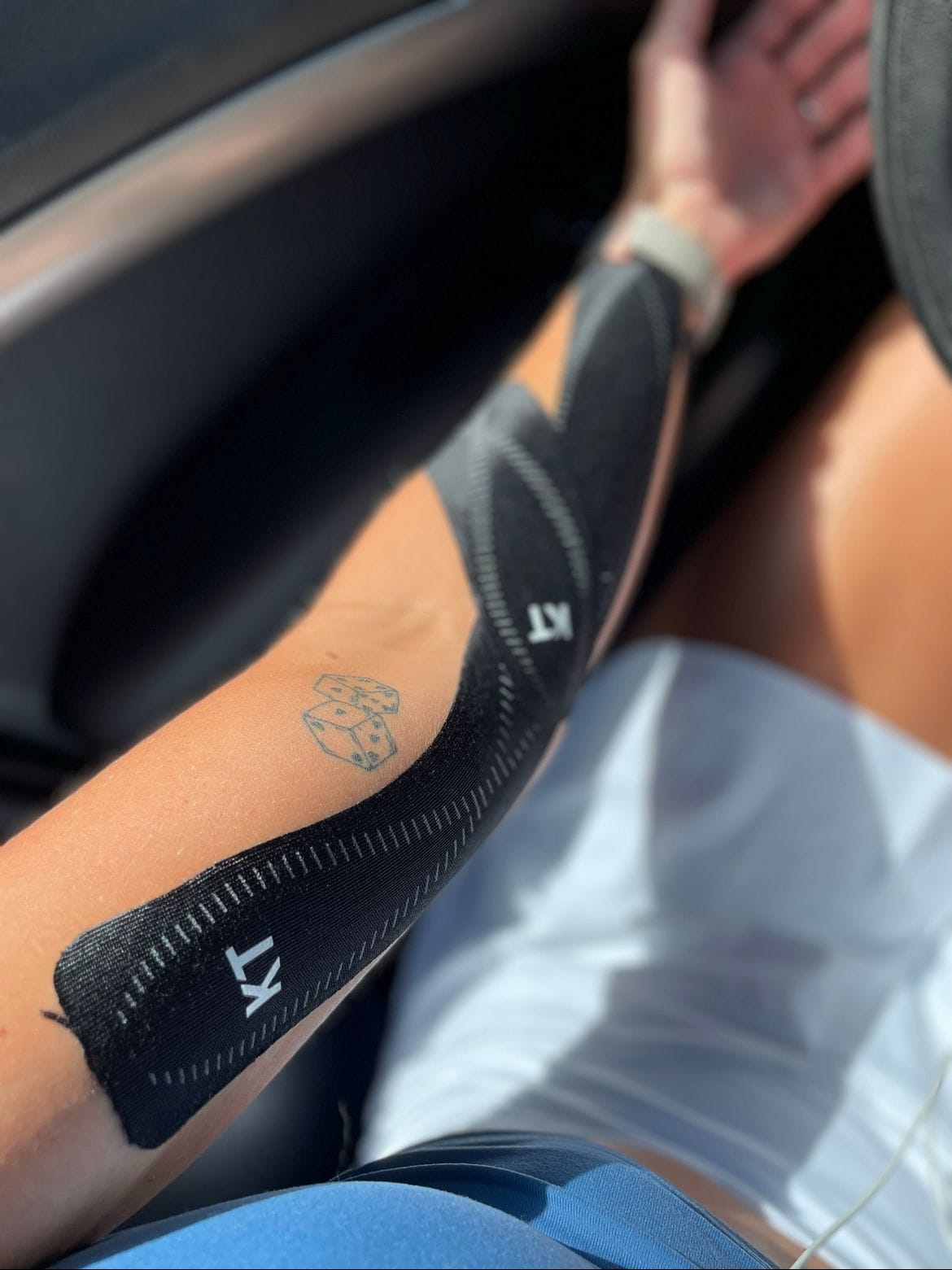 Elizabeth's arm with athletic tape