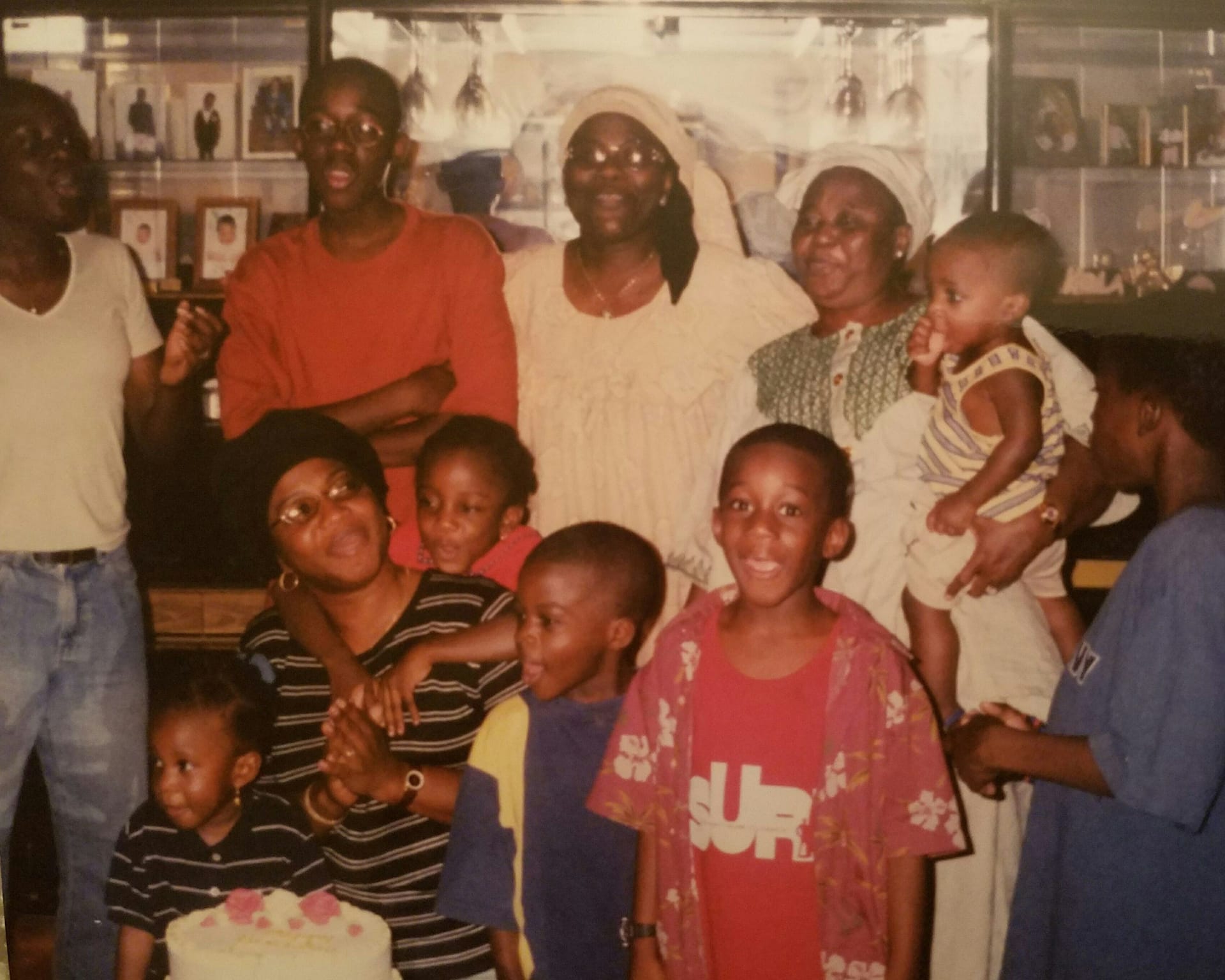 A young Adigun in a family photo with other children