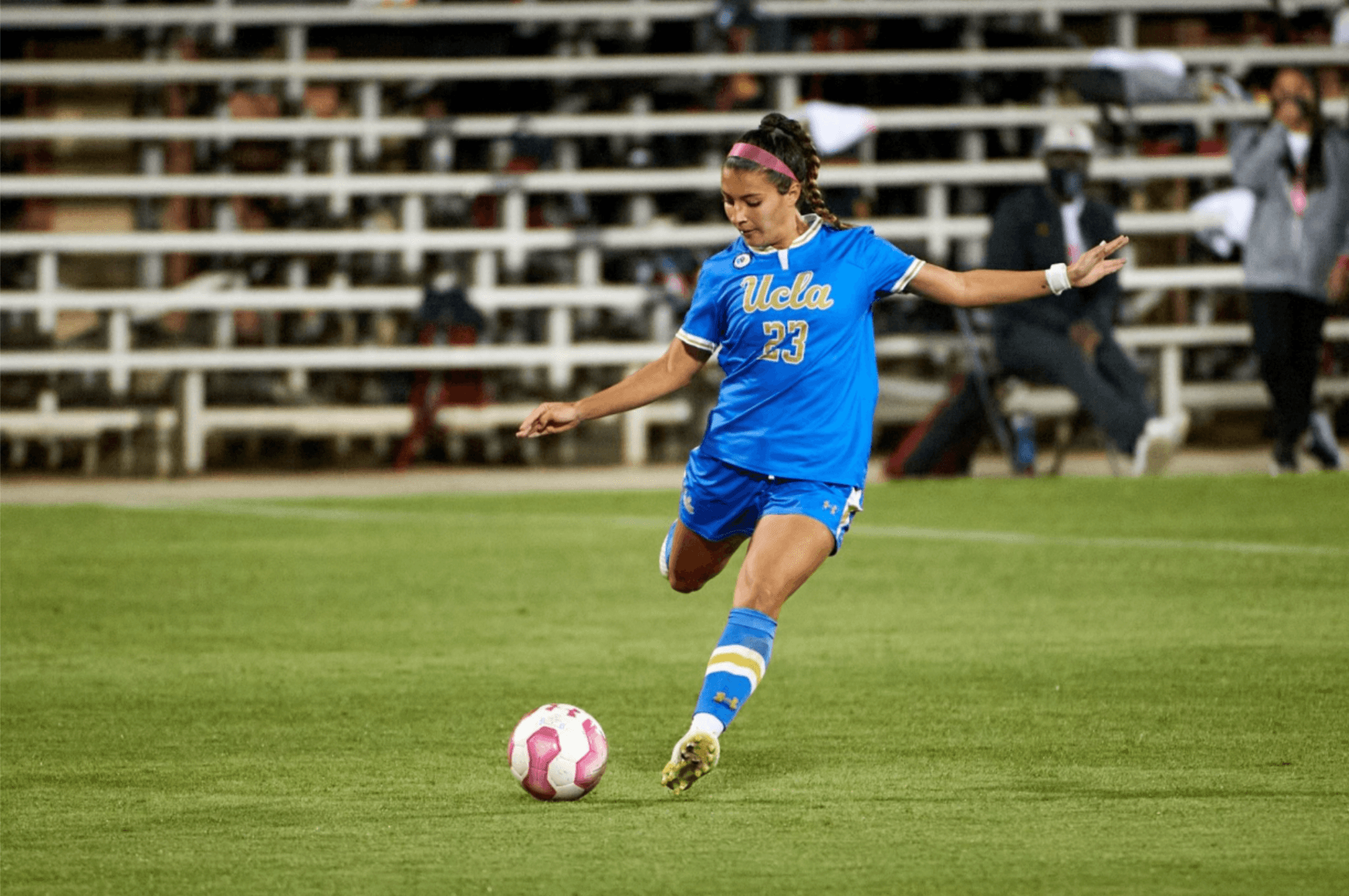 Marley kicking a soccerball on the field