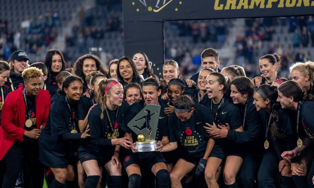 NWSL championship game winners celebrate with trophy
