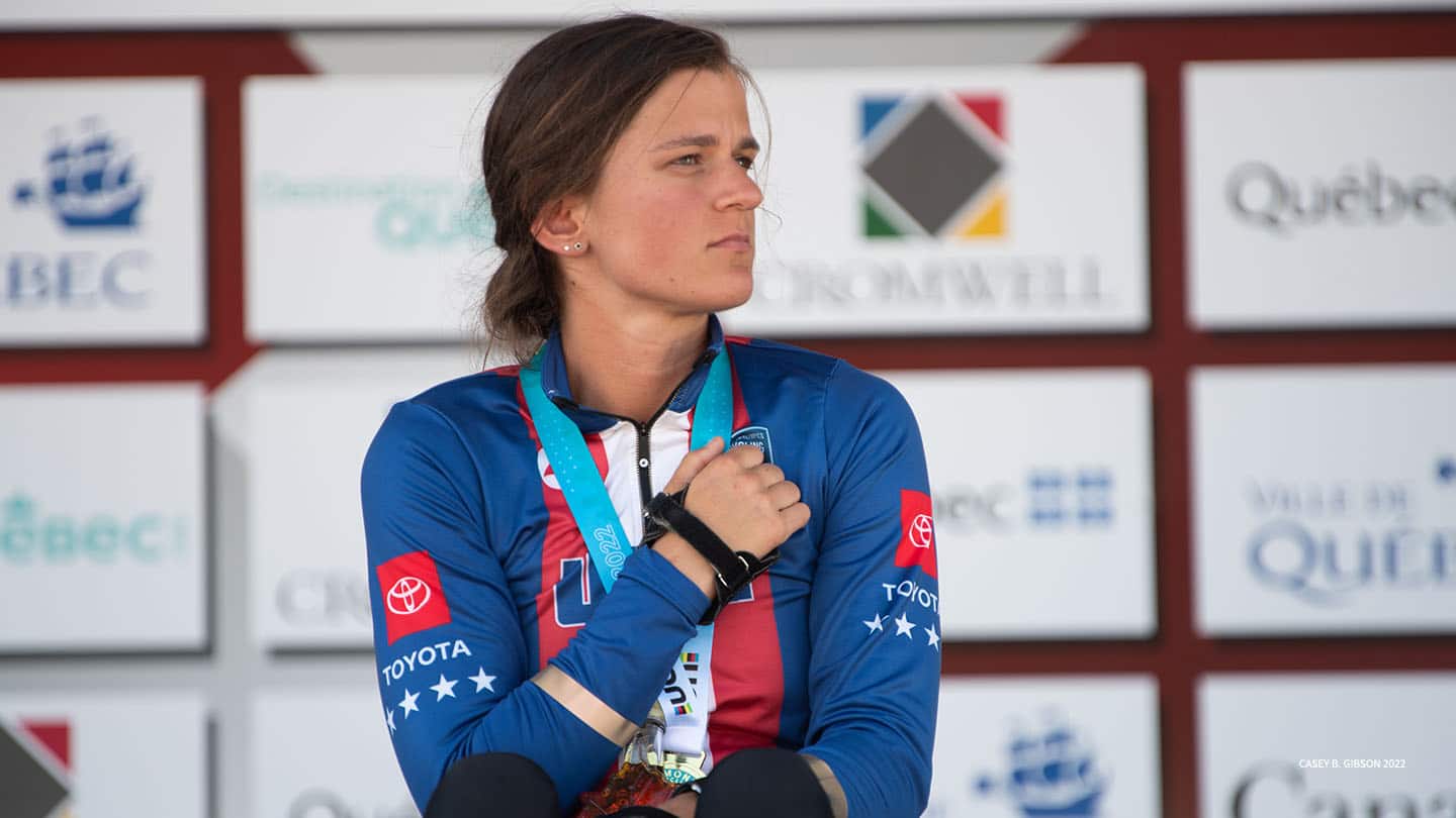 Kate Brim wearing a Paralympic gold medal for cycling