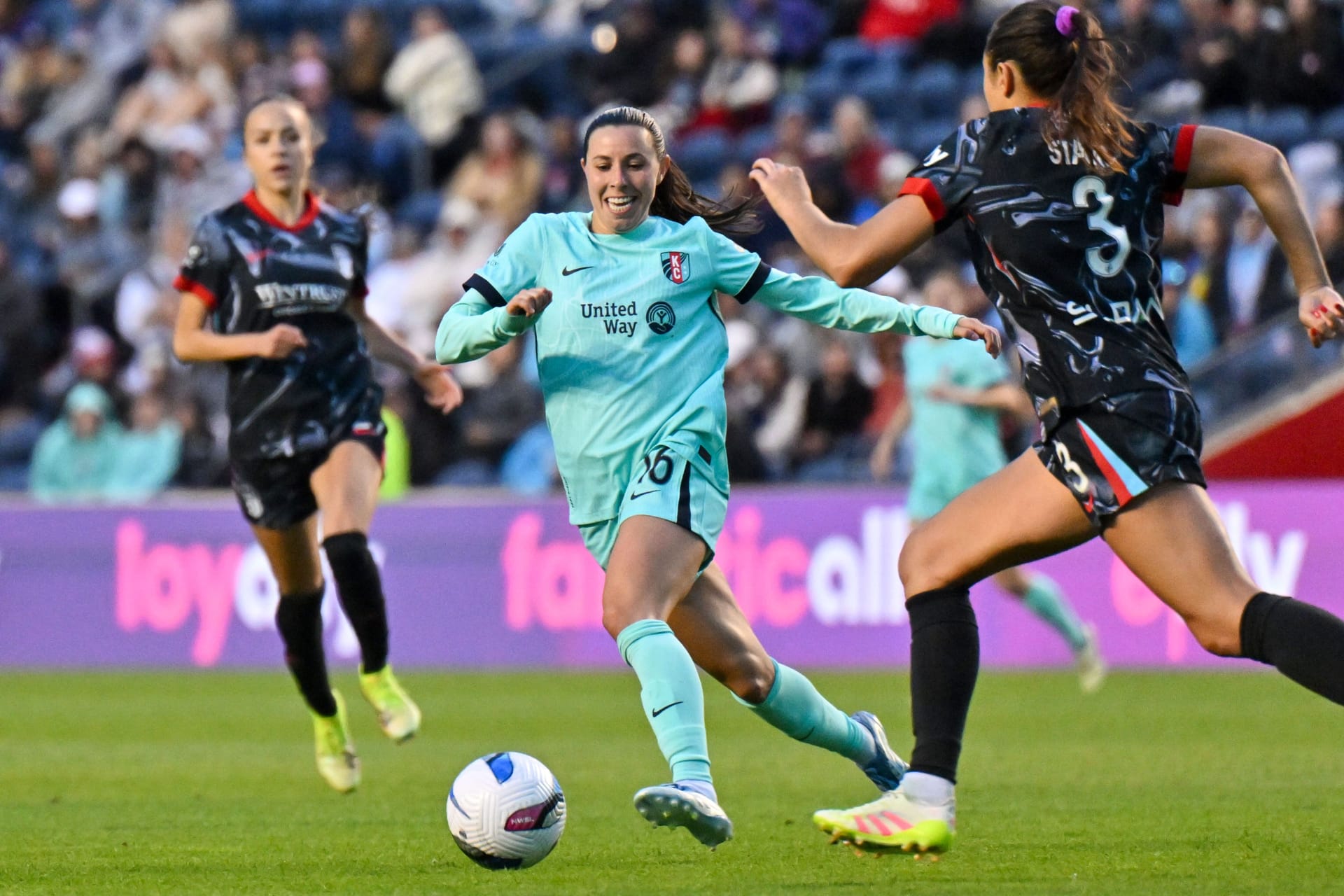 May 24, 2025; Bridgeview, Illinois, USA; Kansas City Current midfielder Vanessa DiBernardo (16) dribbles as Chicago Stars defender Sam Staab (3) defends in the second half at SeatGeek Stadium. Credit: Matt Cashore