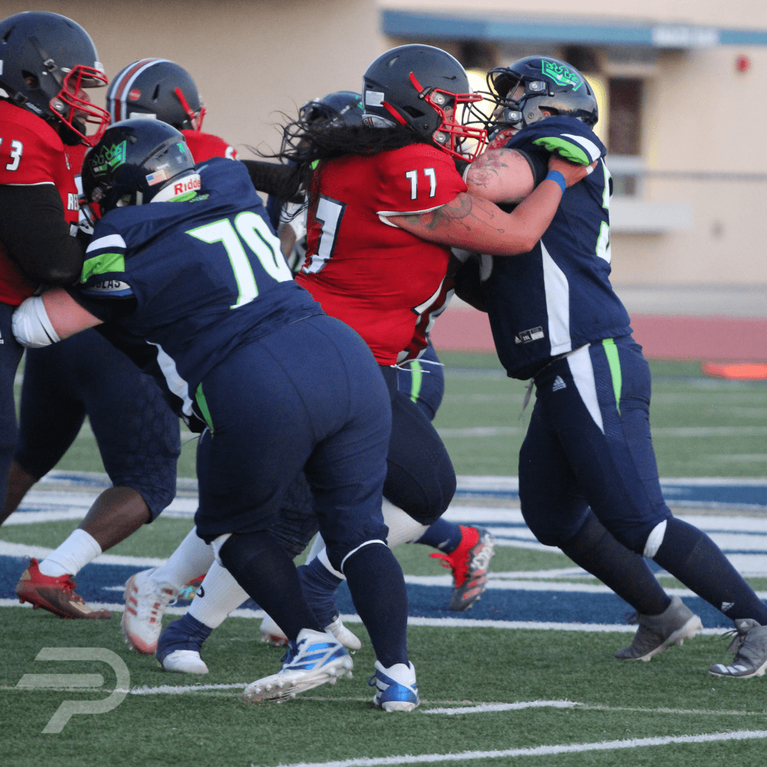 women playing American football in full uniform