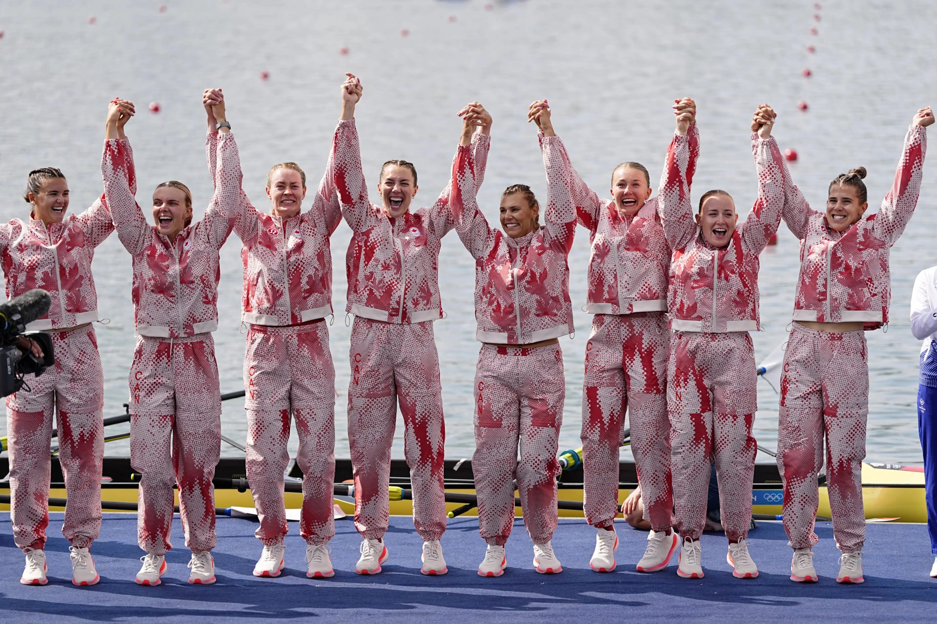 Team Canada celebrates their silver medal during the medal ceremony for the womenís eights during the Paris 2024 Olympic Summer Games at Vaires-sur-Marne Nautical Stadium.