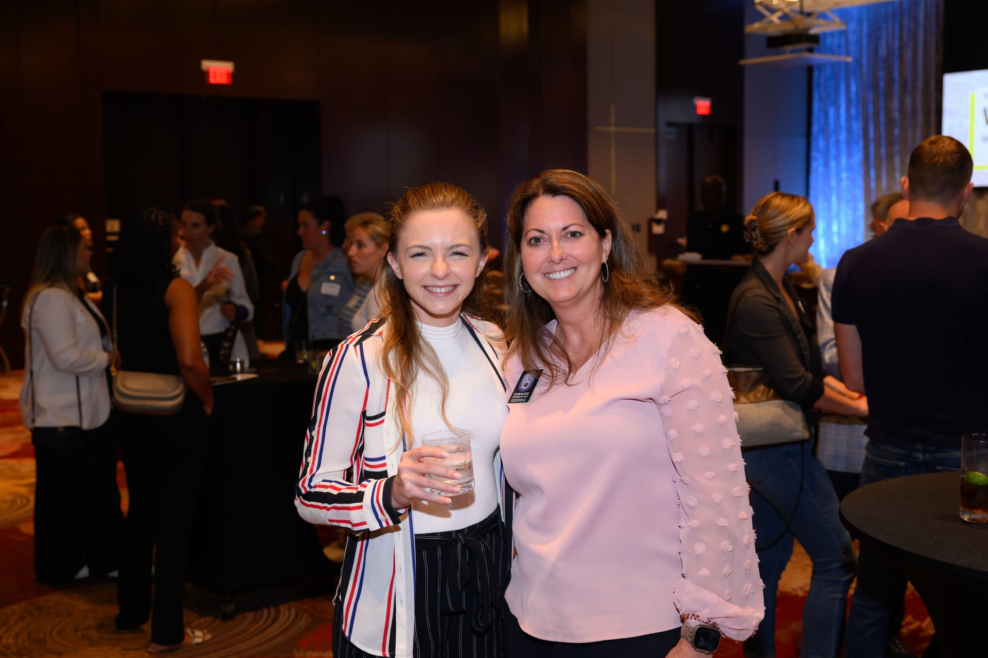 Aurora Straus smiles with Lyn St. James at an event