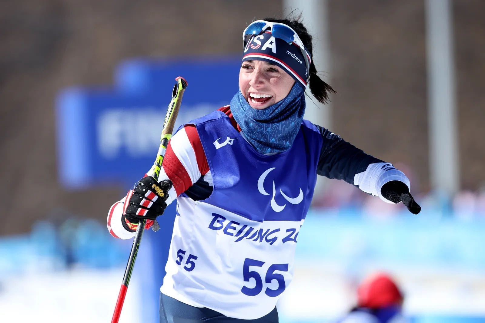 Dany smiling and cross country skiing at the Beijing Paralympics