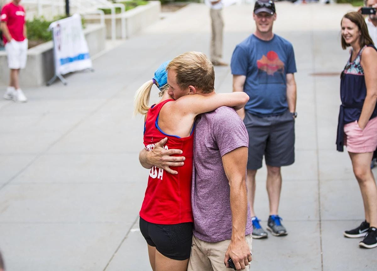 Schultz hugging a loved one after a race