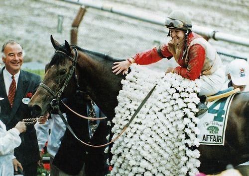Julie Krone and Colonial Affair (horse) wearing flowers after winning Belmont Stakes