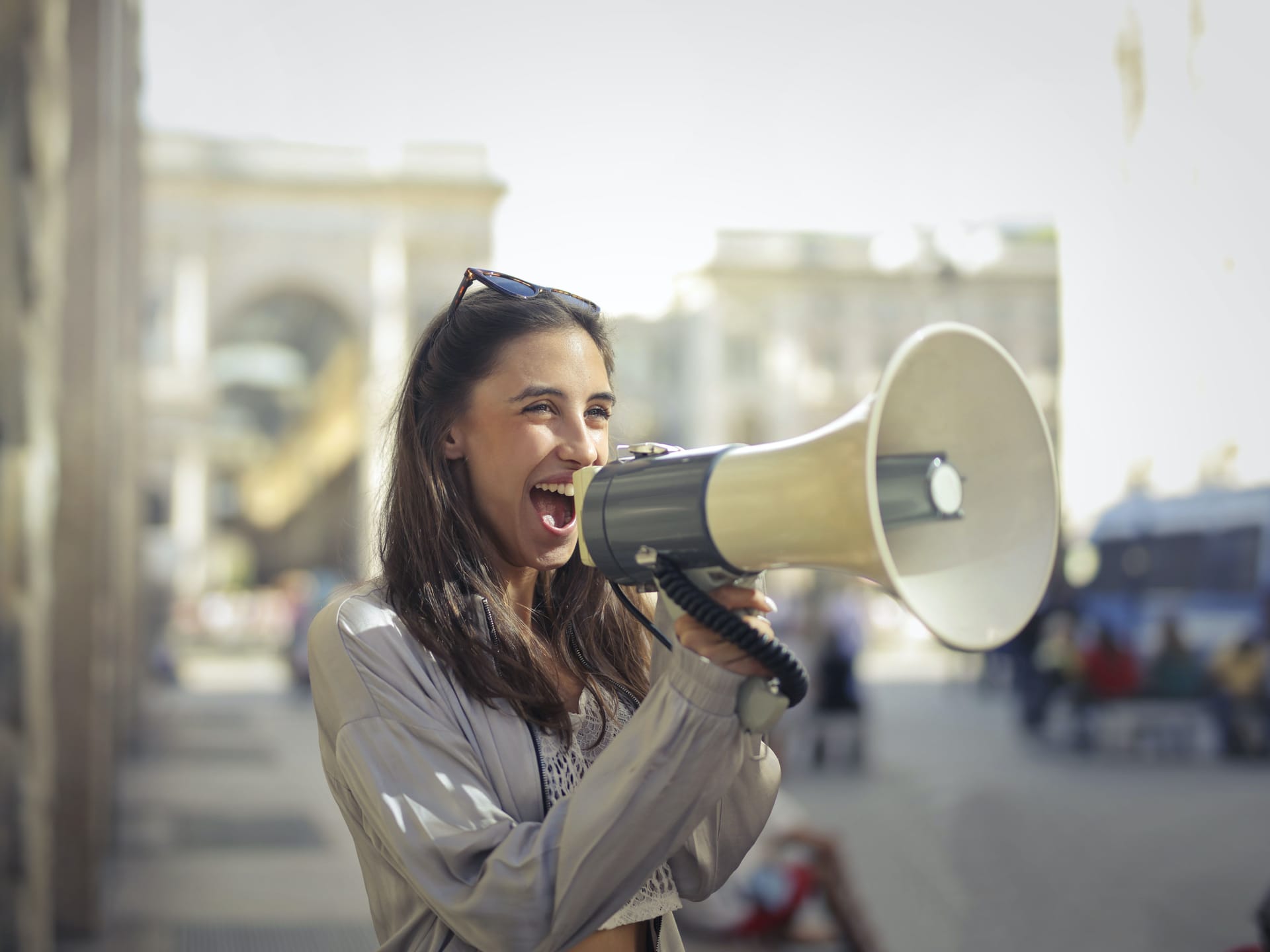 Woman cheering into megaphone